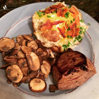 Steak, mushrooms, and loaded baked potato.